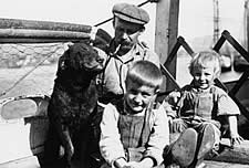 Photo taken in 1911 aboard the St. Katherine - with the captain, his children and his dog Queen